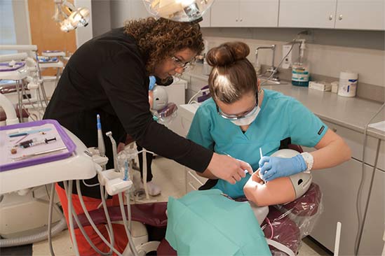 Dental assisting instructor and student